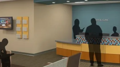 Modern dental clinic waiting room with seating, reception desk, and shadowed figures of people waiting and checking in.