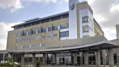 Exterior view of Rideout Regional Medical Center with modern architecture and partly cloudy sky overhead.