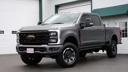 a black truck parked in front of a building