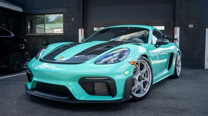 a blue sports car parked in a garage