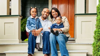 a family sitting on steps