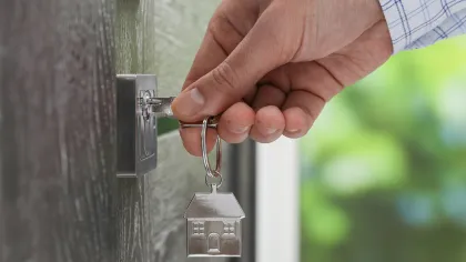a hand holding a key