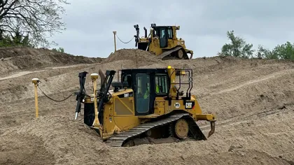 a bulldozer in a dirt field