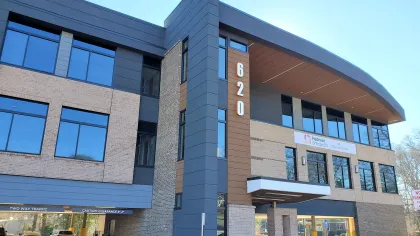 a building with cars parked in front