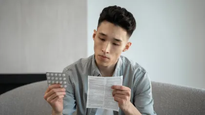 a person holding a piece of paper