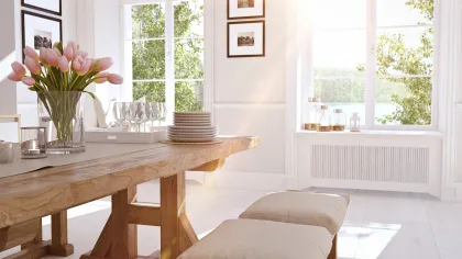 a living room with a table and chairs