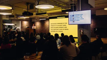 a person giving a presentation to a group of people
