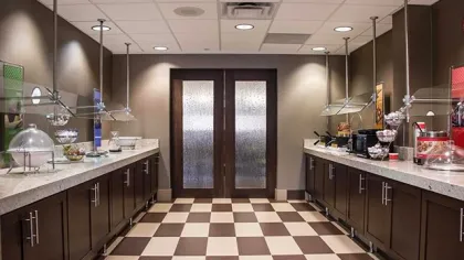 a kitchen with a tile floor