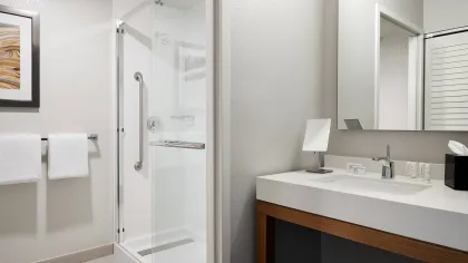 Hotel tub surrounds, shower pans, and shower doors