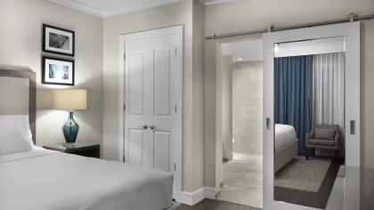 a room filled with furniture and a large window