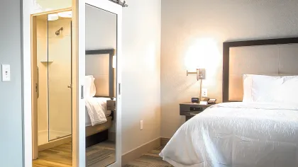 a room filled with furniture and a large window