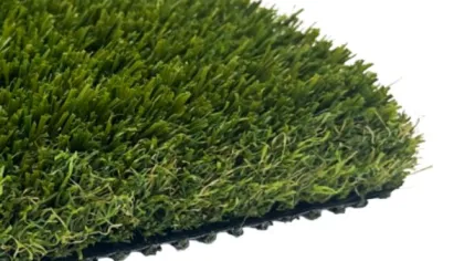 Close-up of durable artificial grass turf with dense green fibers and black backing layer.