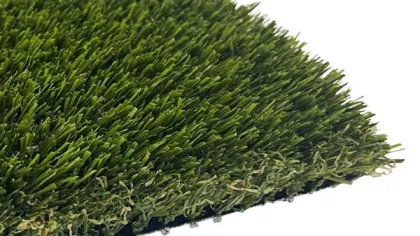 Close-up of a green artificial grass turf sample with black backing on a white background