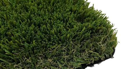 Close-up of lush artificial grass with vibrant green blades and realistic texture, ideal for landscaping.