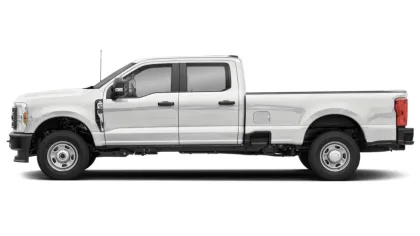 Side view of a white crew cab pickup truck with extended bed on a white background