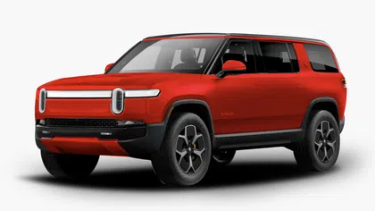 Red Rivian electric SUV with black trim and modern oval headlights shown on white background.