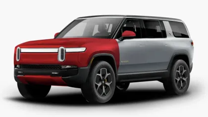 Side view of a two-tone red and silver Rivian electric SUV against a white background