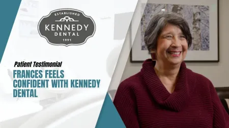 Smiling woman shares her positive testimonial about Kennedy Dental in a bright, professional setting.