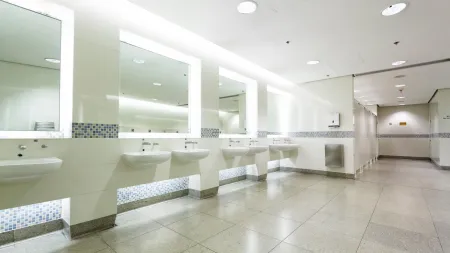 a bathroom with sinks and mirrors