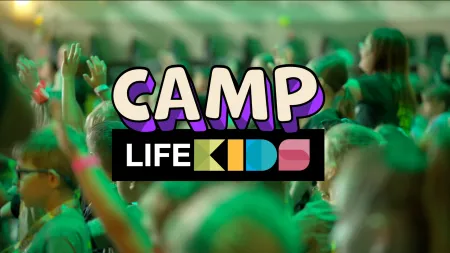 Camp Life Kids logo over blurred crowd of children raising hands in a lively indoor event with green lighting.