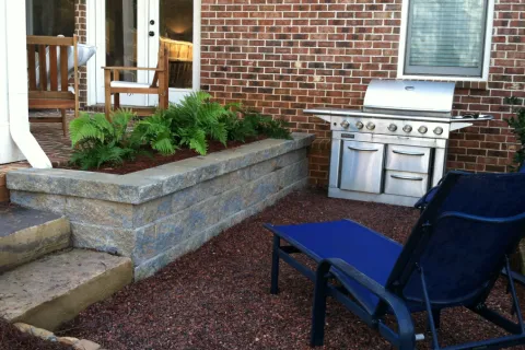 a chair sitting in front of a brick building