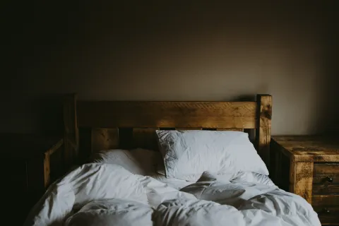 a bed with a pillow