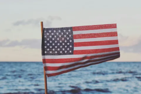 American Flag on a pole in the water