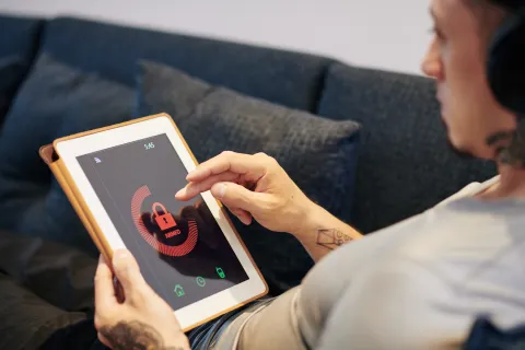 a person holding a tablet