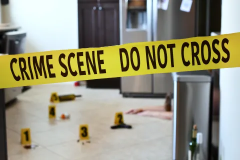 a yellow crime scene sign