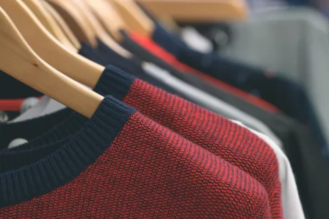 a close-up of red and black sweaters