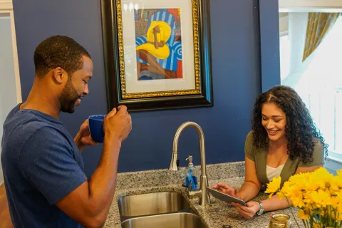 a man and a woman in a kitchen