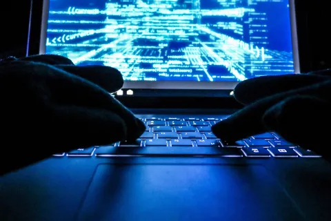 a person typing on a keyboard