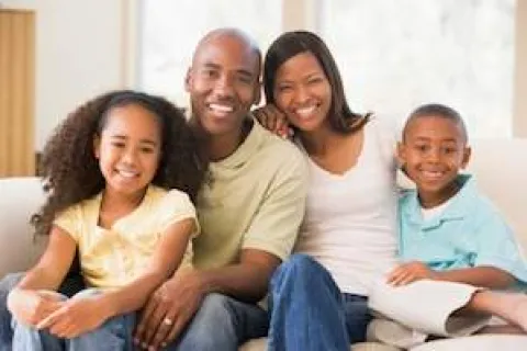 a family sitting together smiling