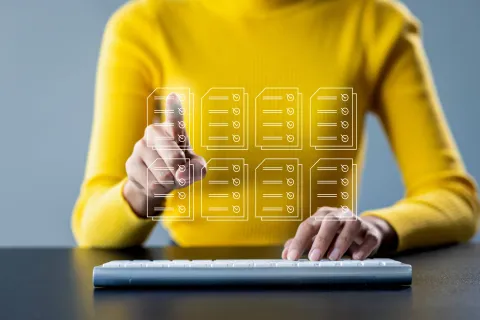 a person holding a yellow board