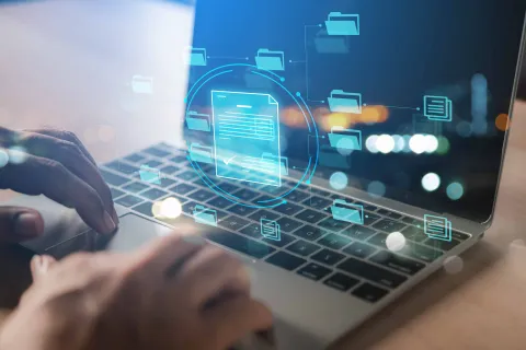 a person typing on a laptop