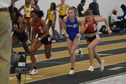 a group of runners on a track