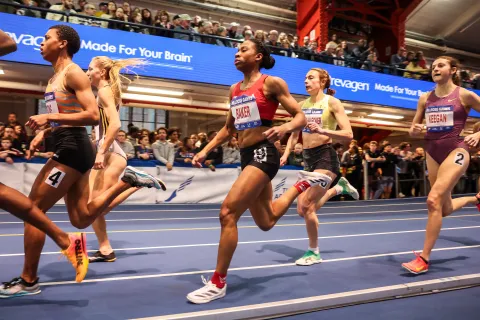 a group of women running on a track