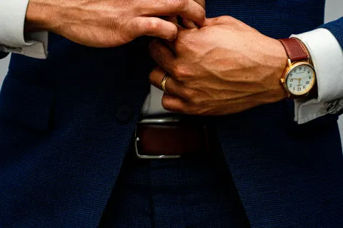 a close-up of a man shaking hands