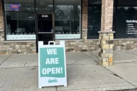a sign on the sidewalk