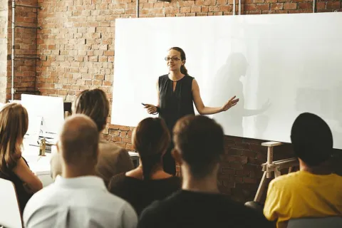 a person standing in front of a group of people