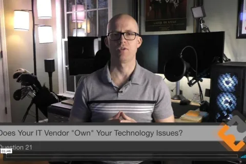 a man sitting in front of a computer