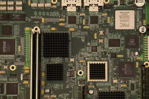 Close-up view of computer motherboard with processors, memory slots, and various electronic components symbolizing cyber hygiene.