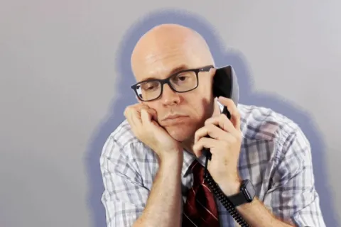 a man talking on a cell phone