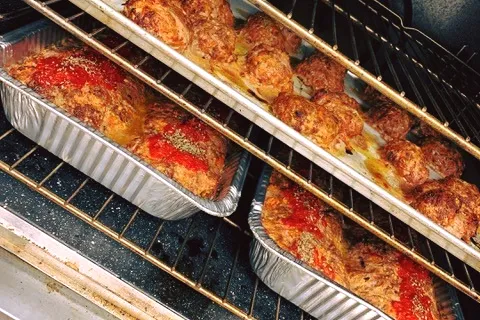 a pizza sitting on top of an oven