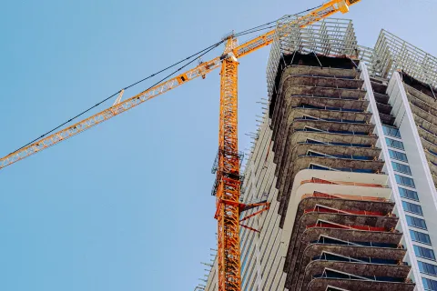 a crane lifting a building