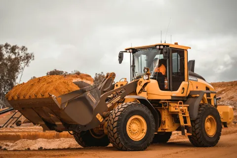 a tractor carrying a load