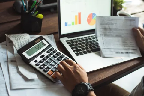 a person using a calculator