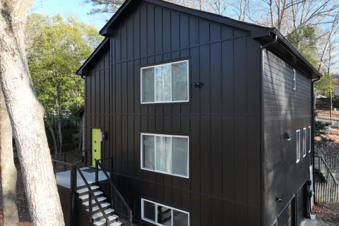 a grey house with a staircase