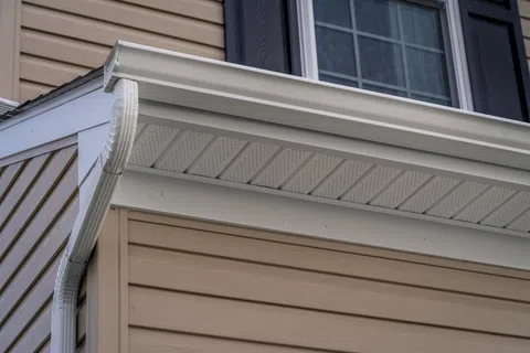 Close-up view of modern house soffit and gutters showcasing clean lines and contemporary design.