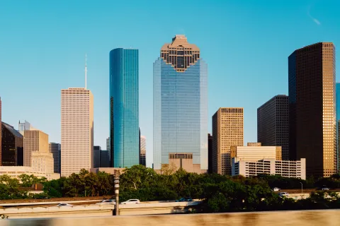 a city skyline with tall buildings